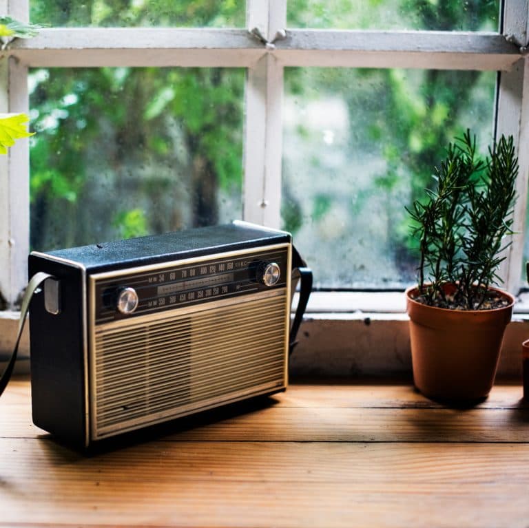 Closeup of vintage radio on wooden table